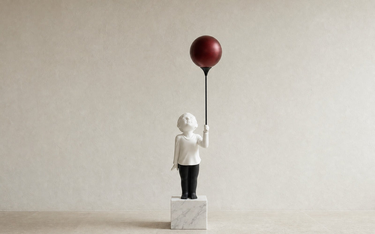 AeroCherub on a plain background, marble base and metal balloon