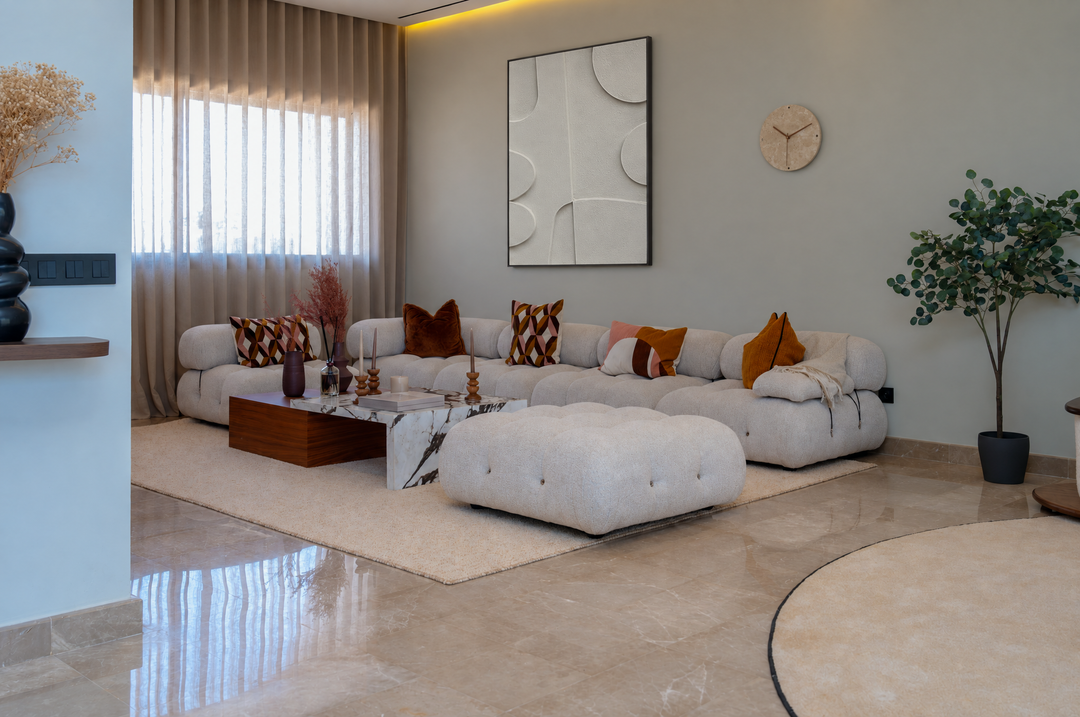 Curva Arco above a modular boucle sofa in a living room