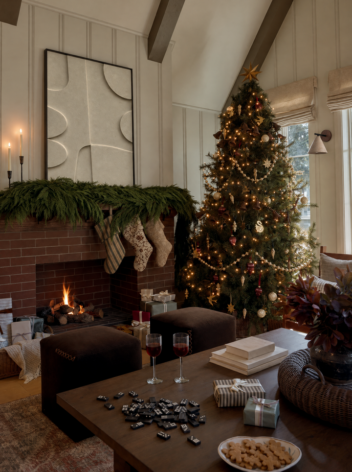 Curva Arco on a brick fireplace mantel dressed for the holidays