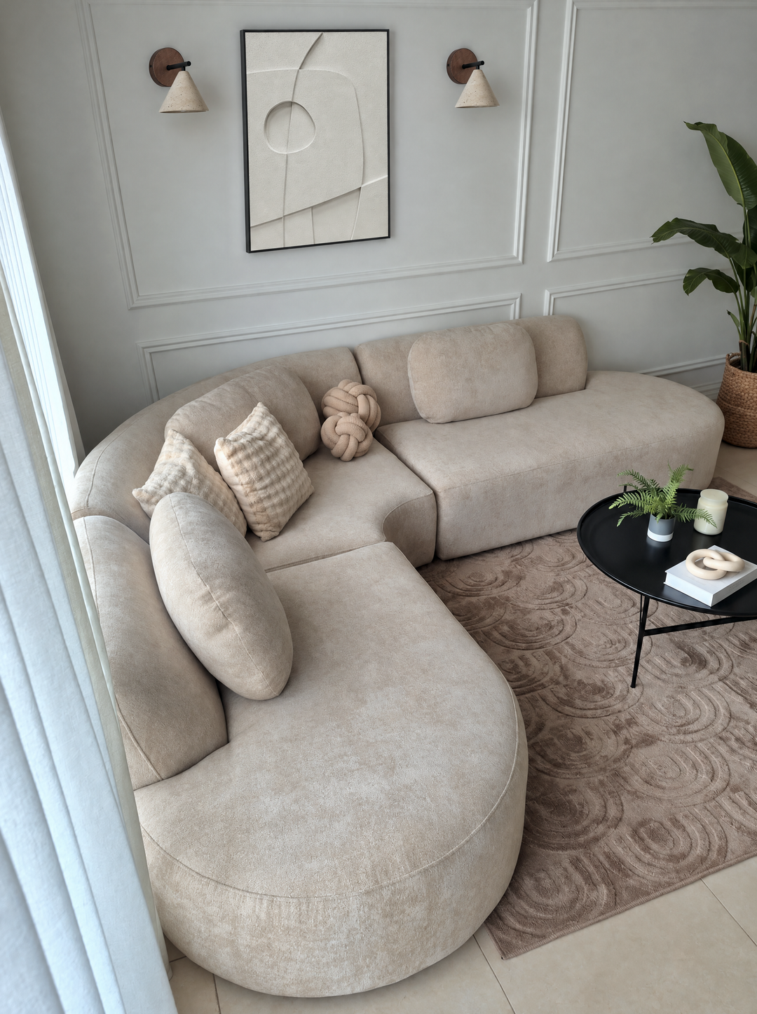 Curva Orma above a curved cream sofa on a paneled wall