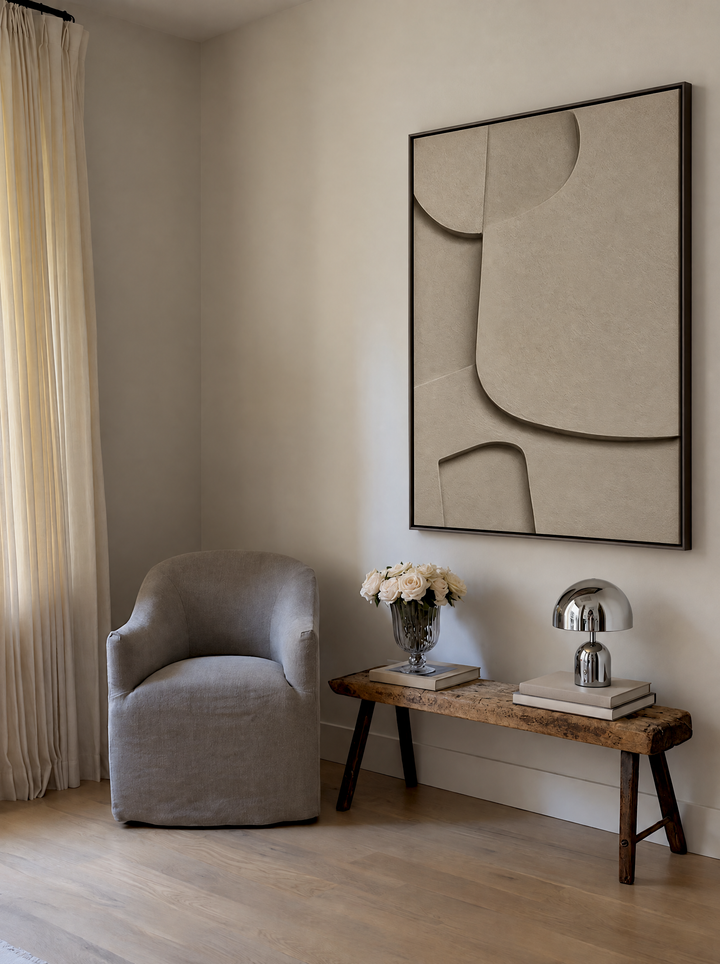 Curva Sasso above a rustic wooden bench beside an armchair