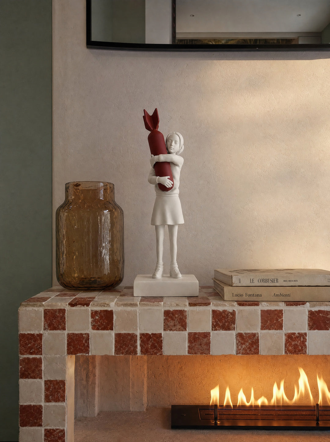 Disarm sculpture standing beside a fireplace at home