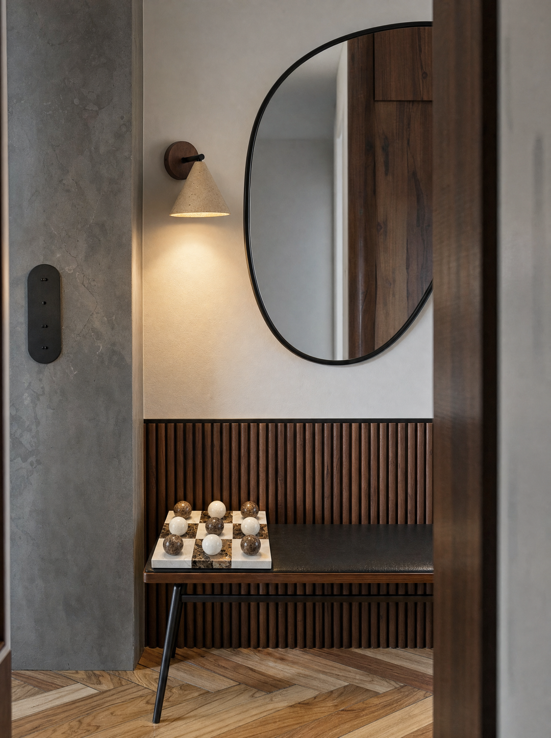 Fonte wall lamp above an entry bench lighting the Lapilli marble board