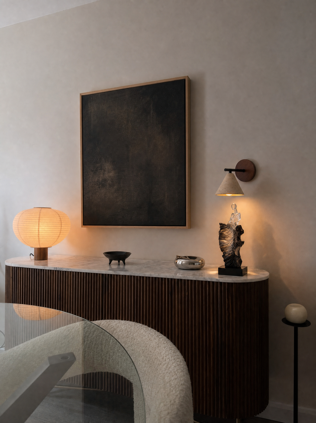 Fonte wall lamp lit above a Dualite sculpture