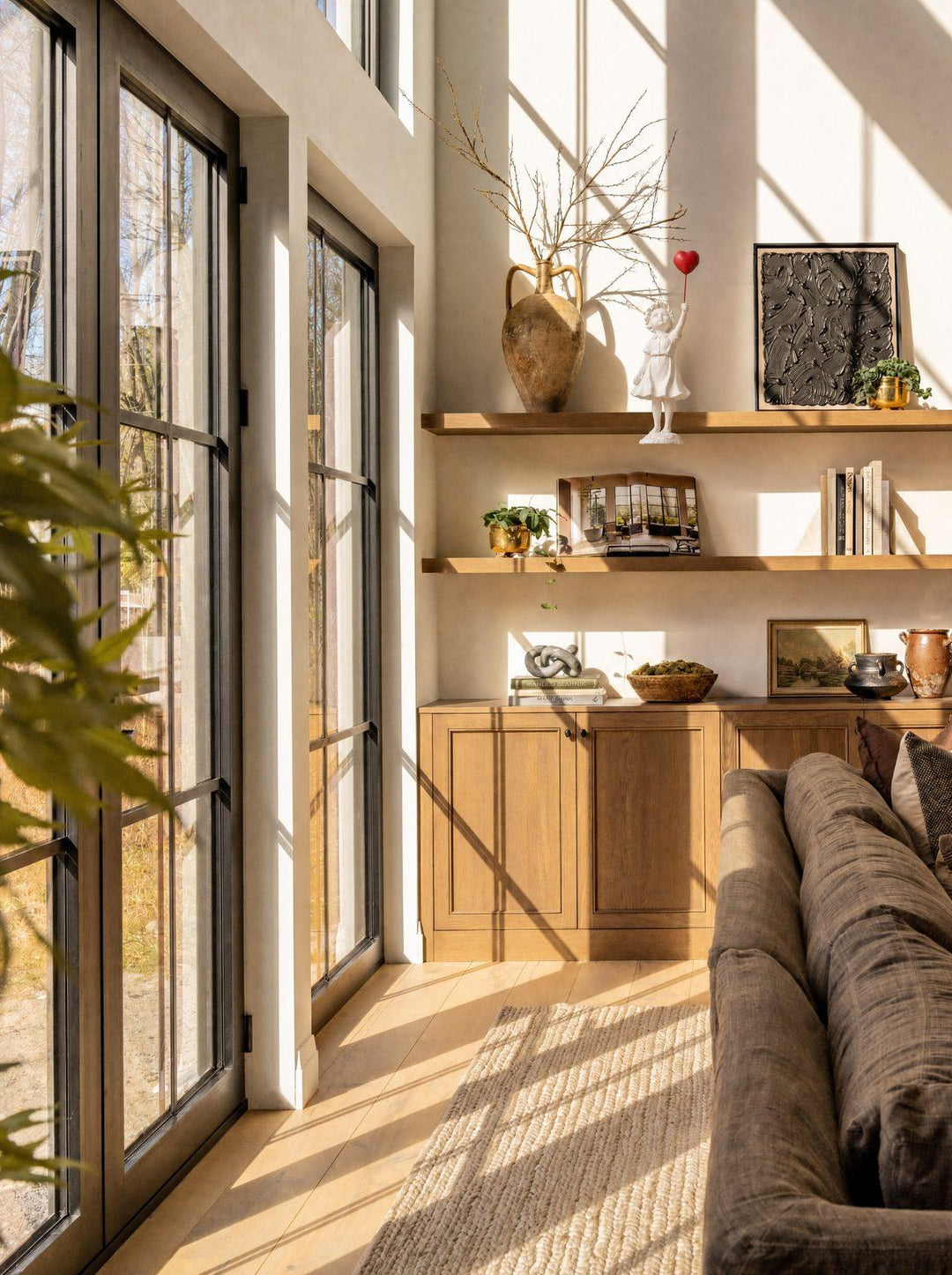 Ascend sculpture on a wooden shelf in a sunlit living room