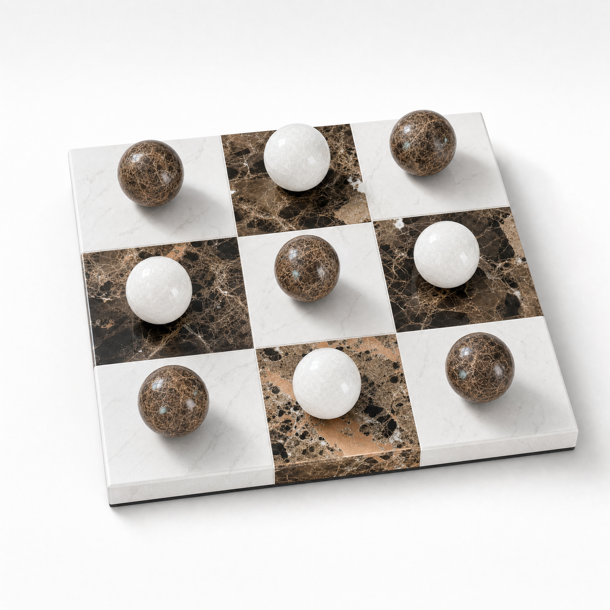 Lapilli marble tic-tac-toe board, studio packshot on white background, all nine spheres set on the board.