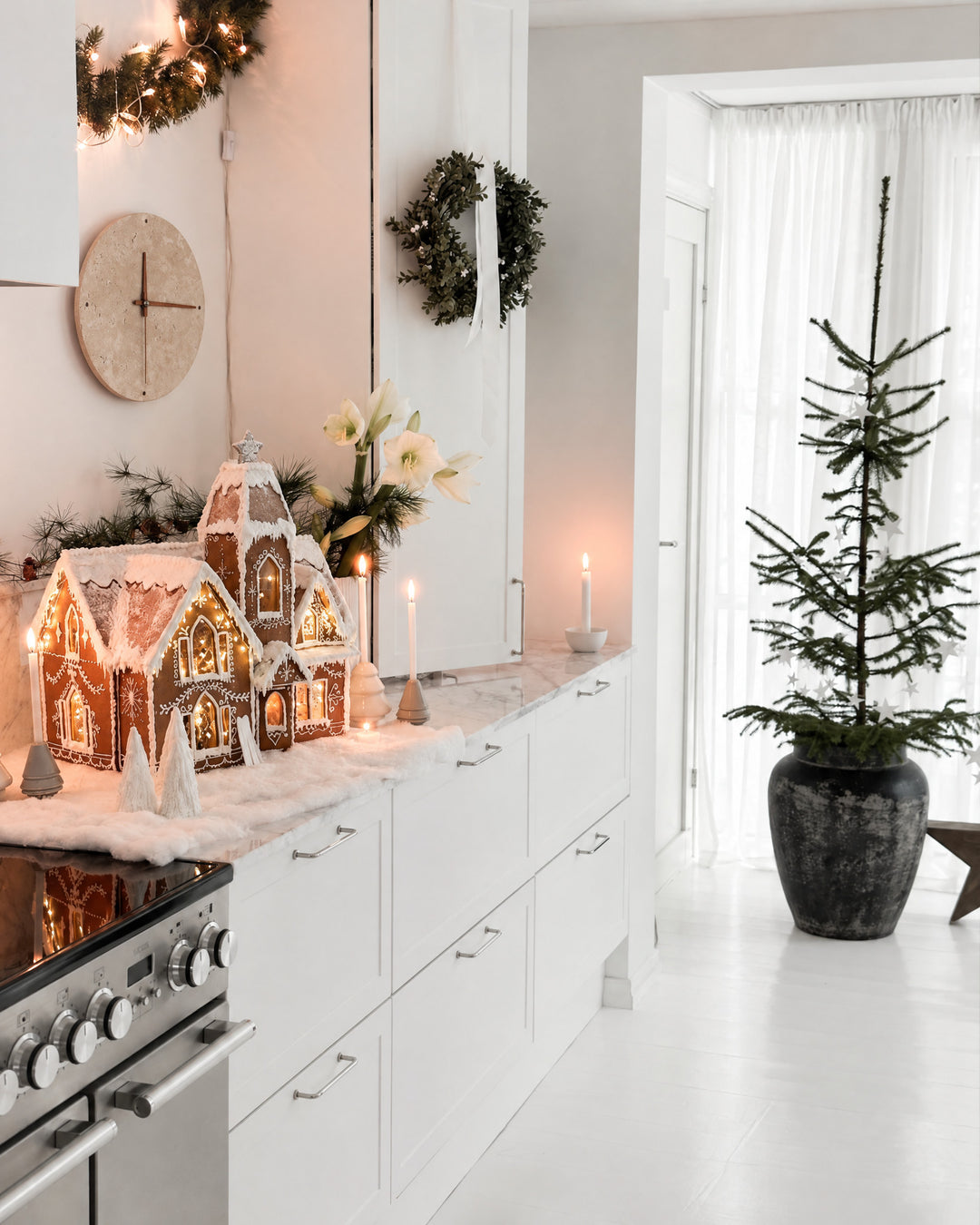Adagio, a clock of cream travertine stone, hangs on a white kitchen wall, nearly one tone with its background.