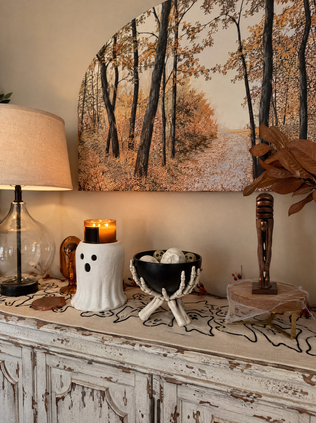 The Echo stands on a console in a warm, deep-toned corner, beside the glow of a table lamp.