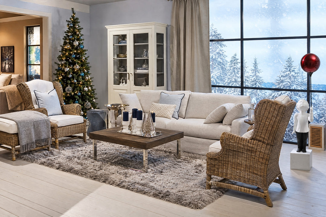 AeroCherub lifts its red balloon in a tall, light-filled living room, where glass doors look onto snowy woods.