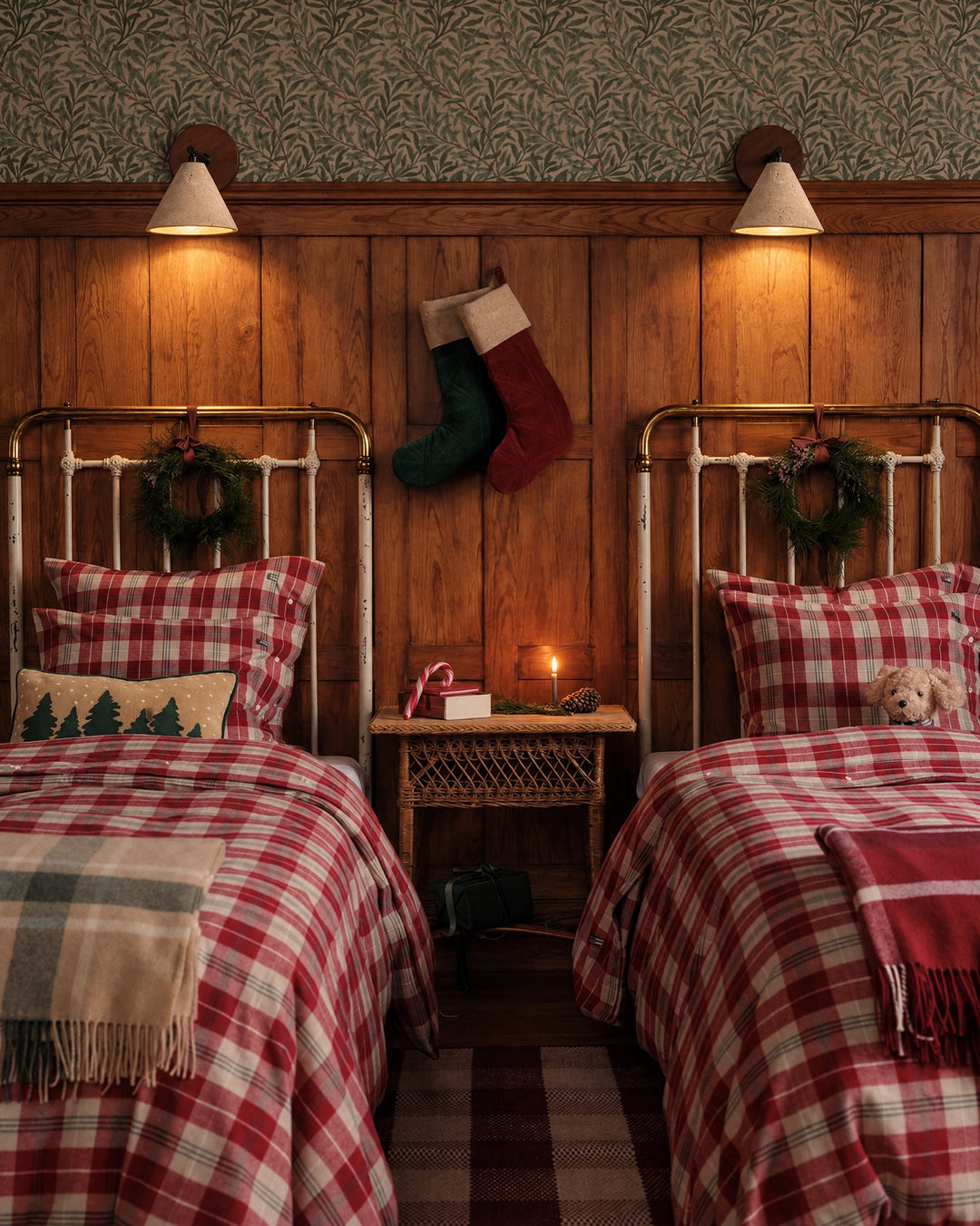 Two Fonte wall lights shine from the wood paneling above twin white iron beds, the light falling only from the open mouth of each stone cone.