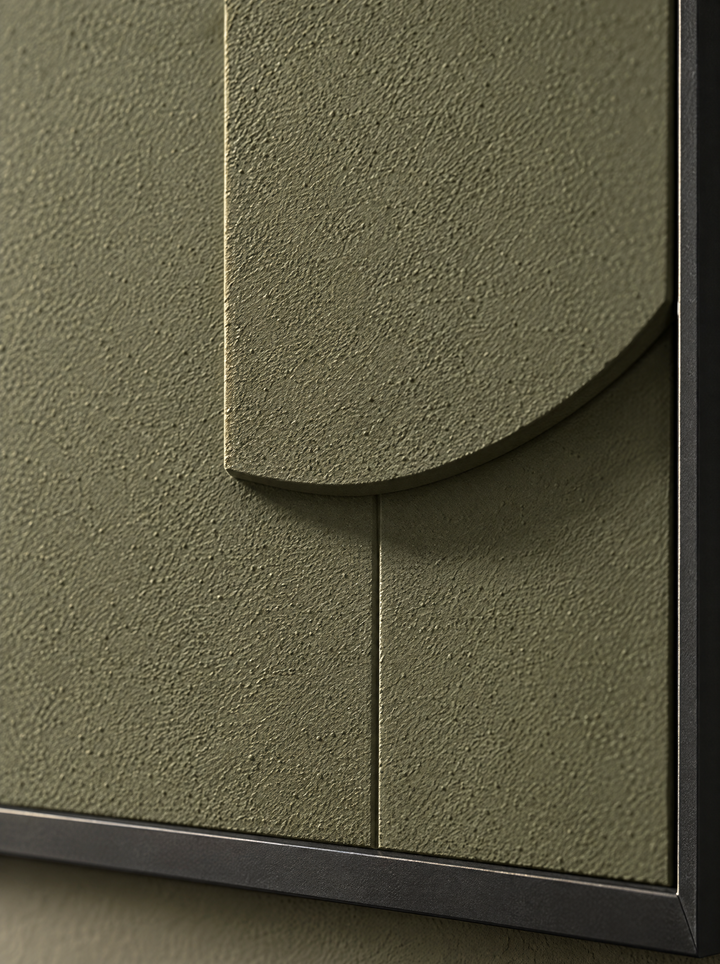 Close view of a round-based upright, a vertical seam and a black frame corner on Tinta in Oliva, with its surface of fine sand