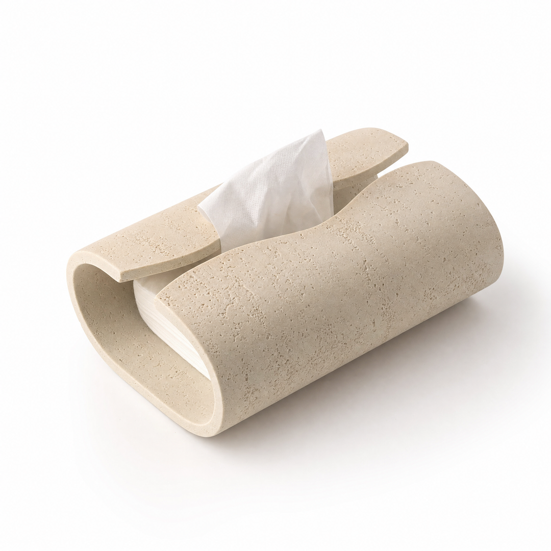 A tissue drawn from the Volute ceramic box on a beige background